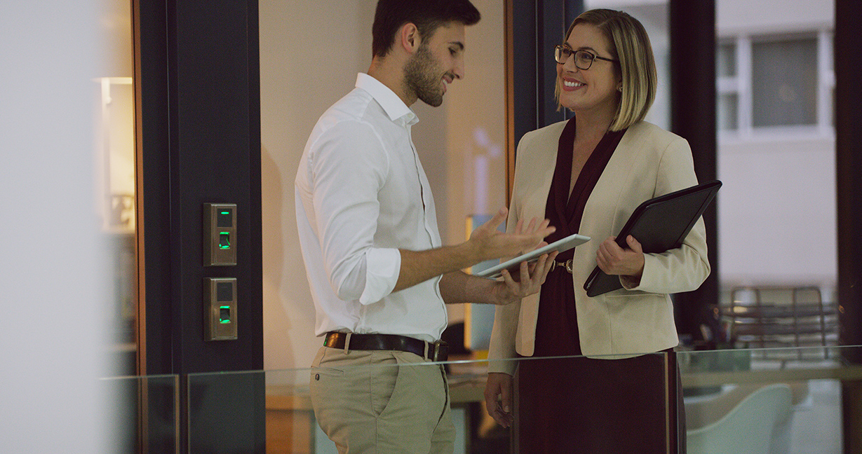 two business people discussing in an office